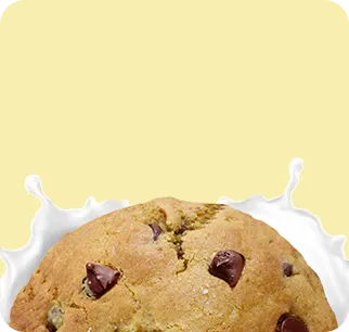 Two A2 dairy chocolate chip cookies crafted with high-quality ingredients on a yellow background